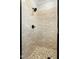 Modern bathroom shower boasts neutral tile walls and river rock floor at 1403 Antioch Church Rd, Timberlake, NC 27583