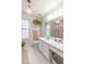 Bright bathroom featuring a white vanity, chandelier and decorative shower curtain at 200 Lindell Dr, Apex, NC 27539