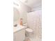Cozy bathroom features a white vanity, round mirror and charming polka dot shower curtain at 200 Lindell Dr, Apex, NC 27539