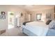 Primary bedroom featuring a full ensuite bathroom, neutral walls, carpet and plentiful light at 200 Lindell Dr, Apex, NC 27539