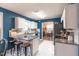 Open concept kitchen with granite counters, white cabinets and breakfast bar at 200 Lindell Dr, Apex, NC 27539
