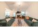 Bright living room showcasing plush couches, a fireplace, and a decorative rug at 200 Lindell Dr, Apex, NC 27539