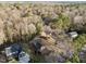 Aerial view of a house surrounded by dense trees and greenery at 2108 Rangecrest Rd, Raleigh, NC 27612
