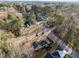 Aerial view of a neighborhood with mature trees and well-maintained streets at 2108 Rangecrest Rd, Raleigh, NC 27612