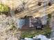 Aerial view of a house with a brick patio and mature trees at 2108 Rangecrest Rd, Raleigh, NC 27612