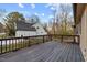 Spacious back deck overlooking a landscaped yard with trees; part of the house is visible at 2108 Rangecrest Rd, Raleigh, NC 27612