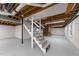 Finished basement featuring a fireplace, painted floors, and access to upper floors at 2108 Rangecrest Rd, Raleigh, NC 27612