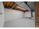 Unfinished section of basement with painted cinderblock walls, plumbing, and utility access at 2108 Rangecrest Rd, Raleigh, NC 27612