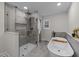 Modern bathroom with a glass-enclosed shower and a freestanding soaking tub for relaxation at 2108 Rangecrest Rd, Raleigh, NC 27612