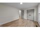 Neutral bedroom with hardwood flooring, natural light, and double door closet at 2108 Rangecrest Rd, Raleigh, NC 27612