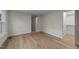 Bedroom featuring hardwood flooring and trim, with a neutral color palette at 2108 Rangecrest Rd, Raleigh, NC 27612