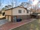 Two-story home with a two-car garage, brick details, and rear patio at 2108 Rangecrest Rd, Raleigh, NC 27612