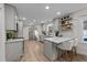 Modern kitchen with gray cabinets, quartz countertops, and stainless steel appliances at 2108 Rangecrest Rd, Raleigh, NC 27612