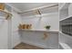 Spacious walk-in closet with ample shelving, hanging rods, and storage solutions for organized living at 2108 Rangecrest Rd, Raleigh, NC 27612