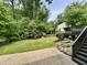 Secluded backyard featuring a well-maintained lawn and deck at 2115 Port Royal Rd, Raleigh, NC 27609