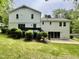 Expansive backyard with patio, lawn, and mature trees, perfect for outdoor living at 2115 Port Royal Rd, Raleigh, NC 27609