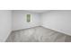 Bright bedroom with soft carpet and a window with natural views at 2115 Port Royal Rd, Raleigh, NC 27609