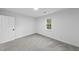 Clean bedroom with neutral carpet and a window with natural views at 2115 Port Royal Rd, Raleigh, NC 27609