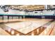 Community gymnasium with a basketball court, bleachers, and high ceilings at 2115 Port Royal Rd, Raleigh, NC 27609