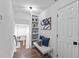 Hallway with bench seating and built-in shelves, showcasing stylish details at 2115 Port Royal Rd, Raleigh, NC 27609