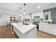 Beautiful kitchen showcasing a large island, modern fixtures, and stainless steel appliances at 2115 Port Royal Rd, Raleigh, NC 27609