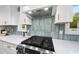 Modern kitchen features custom backsplash, quartz countertops, and stainless steel appliances at 2115 Port Royal Rd, Raleigh, NC 27609