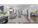 Inviting living room with large windows, hardwood flooring, and neutral decor at 2115 Port Royal Rd, Raleigh, NC 27609