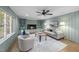 Inviting living room features a fireplace, large window, and comfortable seating, creating a perfect space for relaxation at 2115 Port Royal Rd, Raleigh, NC 27609
