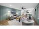 Comfortable living room with stylish furniture, wood paneling, and an open layout for easy access to other areas at 2115 Port Royal Rd, Raleigh, NC 27609