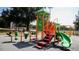 Community playground with colorful equipment, including slides, swings, and climbing structures at 2115 Port Royal Rd, Raleigh, NC 27609