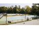 Community tennis courts surrounded by trees, benches, and lampposts at 2115 Port Royal Rd, Raleigh, NC 27609