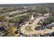 Aerial view of the neighborhood showcasing the home's location near a pond, green spaces, and community amenities at 2128 Arborwood Dr, Durham, NC 27705
