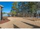 Expansive backyard with lush green space, complemented by mature trees providing privacy and shade at 2128 Arborwood Dr, Durham, NC 27705