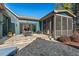Stone patio with outdoor dining and cooking areas, ideal for entertaining and adjacent to a screened in porch at 2128 Arborwood Dr, Durham, NC 27705