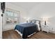 Bright and airy bedroom featuring hardwood floors and soft natural light at 2128 Arborwood Dr, Durham, NC 27705