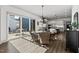 Inviting breakfast area with a round table, wicker chairs, and a large sliding glass door leading to an outdoor patio at 2128 Arborwood Dr, Durham, NC 27705
