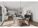 Charming breakfast room featuring hardwood floors, a round table, and a view into the modern kitchen at 2128 Arborwood Dr, Durham, NC 27705