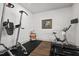 Bright workout room with plantation shutters and exercise equipment at 2128 Arborwood Dr, Durham, NC 27705