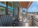 Spacious front porch with rocking chairs, stone pillars, and a comfortable seating area at 2128 Arborwood Dr, Durham, NC 27705