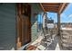 Inviting front porch showcasing a wooden door, rocking chairs, and stylish design at 2128 Arborwood Dr, Durham, NC 27705