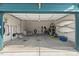 Spacious garage with ample storage space, equipped with racks, shelves, and room for multiple vehicles at 2128 Arborwood Dr, Durham, NC 27705