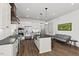 Well-designed kitchen with stainless steel appliances and a center island with a sink and seating at 2128 Arborwood Dr, Durham, NC 27705
