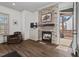 Bright living room with stacked stone fireplace and wood-look flooring at 2128 Arborwood Dr, Durham, NC 27705