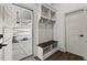 Convenient mudroom with built-in storage, bench seating, and garage access at 2128 Arborwood Dr, Durham, NC 27705