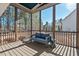 Relaxing screened porch featuring comfortable seating and views of the surrounding wooded landscape at 2128 Arborwood Dr, Durham, NC 27705