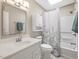 This bathroom features a white sink and vanity, a toilet, a shower, and a white shower curtain at 228 Finley Forest Dr, Chapel Hill, NC 27517