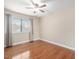 This bedroom features wood floors and a window with blinds and curtains at 228 Finley Forest Dr, Chapel Hill, NC 27517