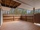A spacious deck features a wood floor and a lattice railing with a gate at 228 Finley Forest Dr, Chapel Hill, NC 27517