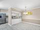 Dining area adjacent to the kitchen featuring modern lighting at 228 Finley Forest Dr, Chapel Hill, NC 27517