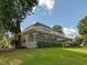 Beautiful home exterior with a porch, green lawn, and mature trees at 228 Finley Forest Dr, Chapel Hill, NC 27517